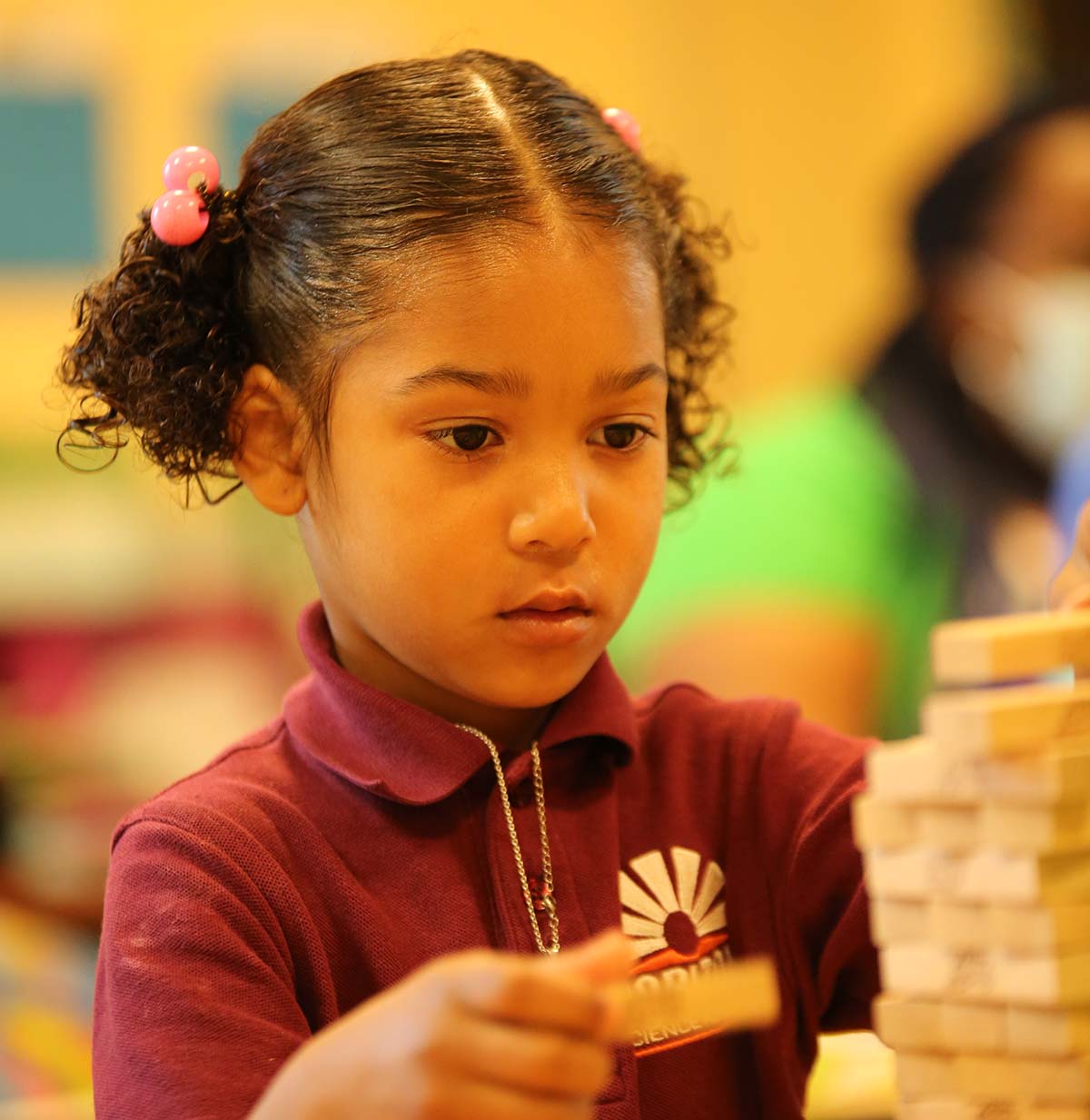 Student drawing in a classroom.