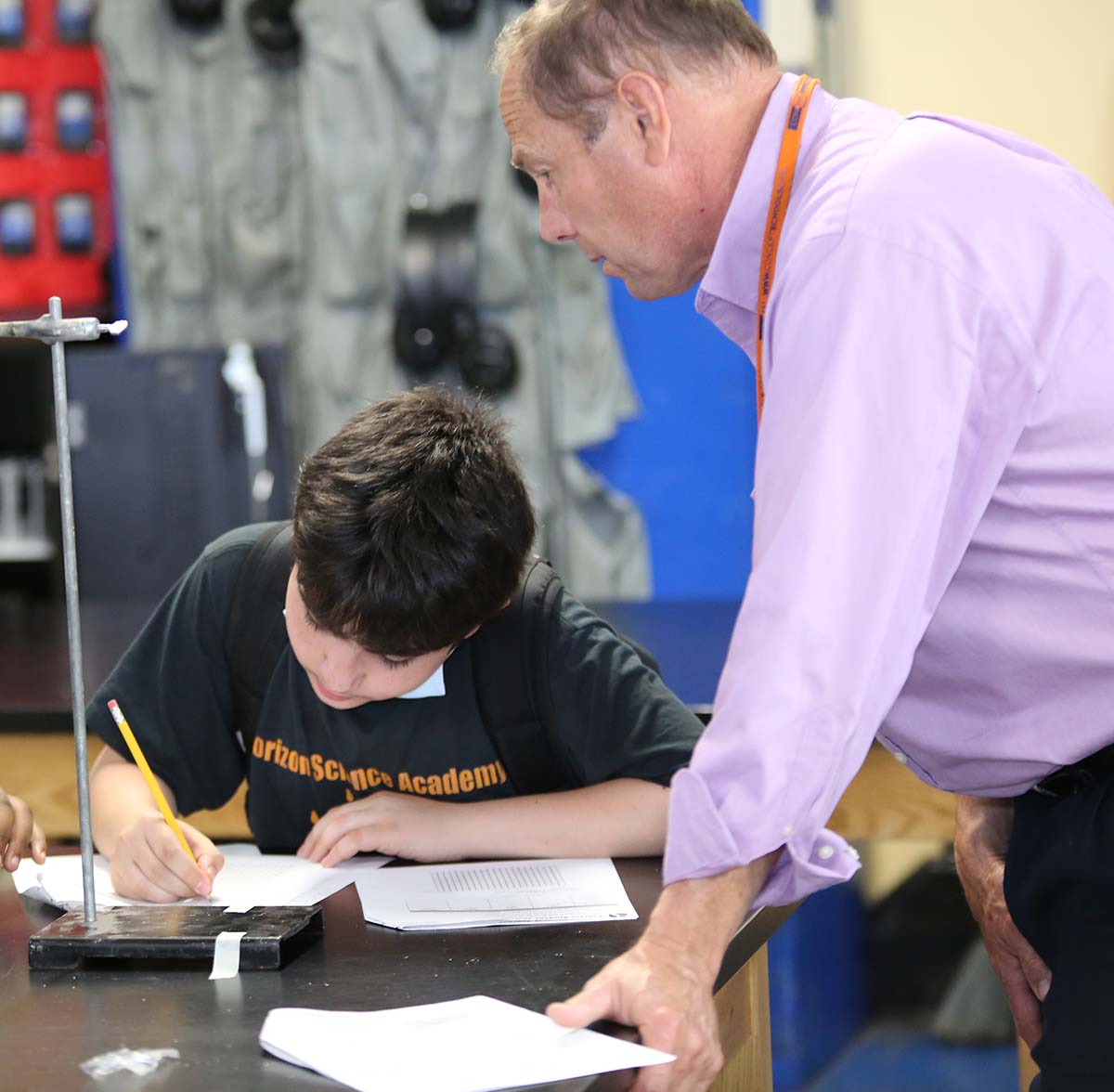 HSA Dayton Downtown Teacher and student interacting at a classroom desk