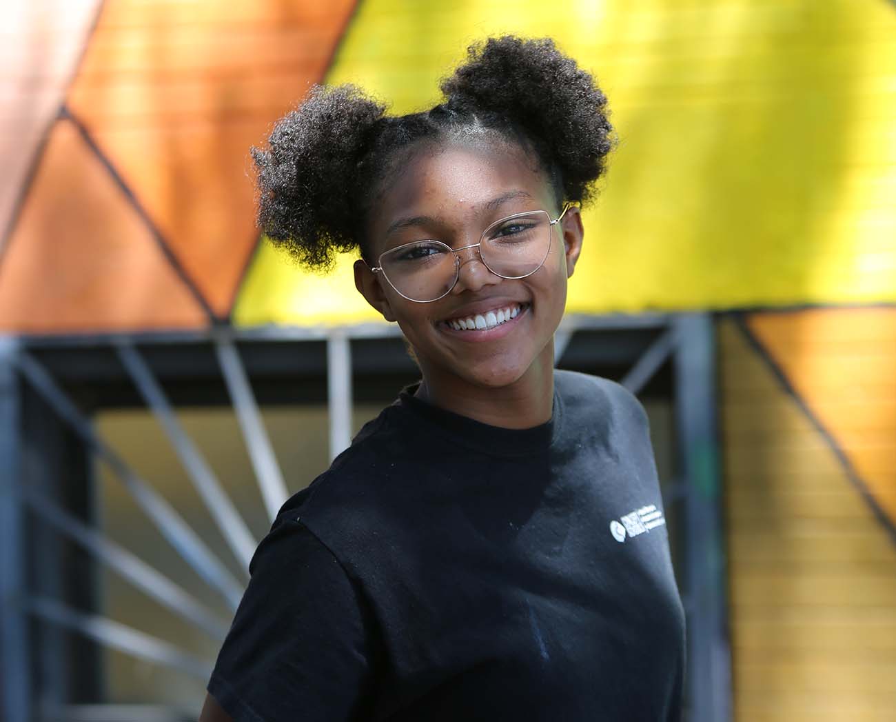 Smiling children together outdoors.